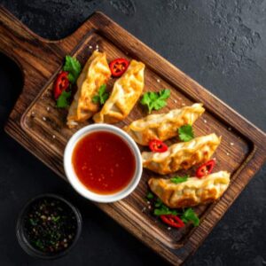 Veg Tomato Garlic Momos [6 Pieces]